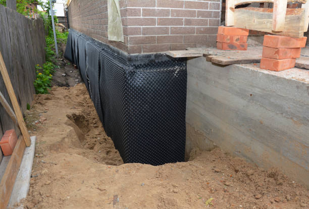 SJ Waterproofing Pros technician performing targeted Exterior Waterproofing assessment in Carson City, MI